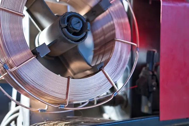 reel of mig welding wire in a wire feeder