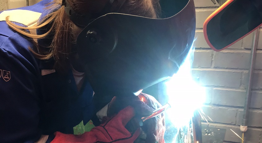 Female welding student