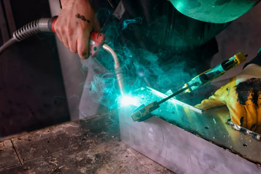 mig welding steel with welding fumes